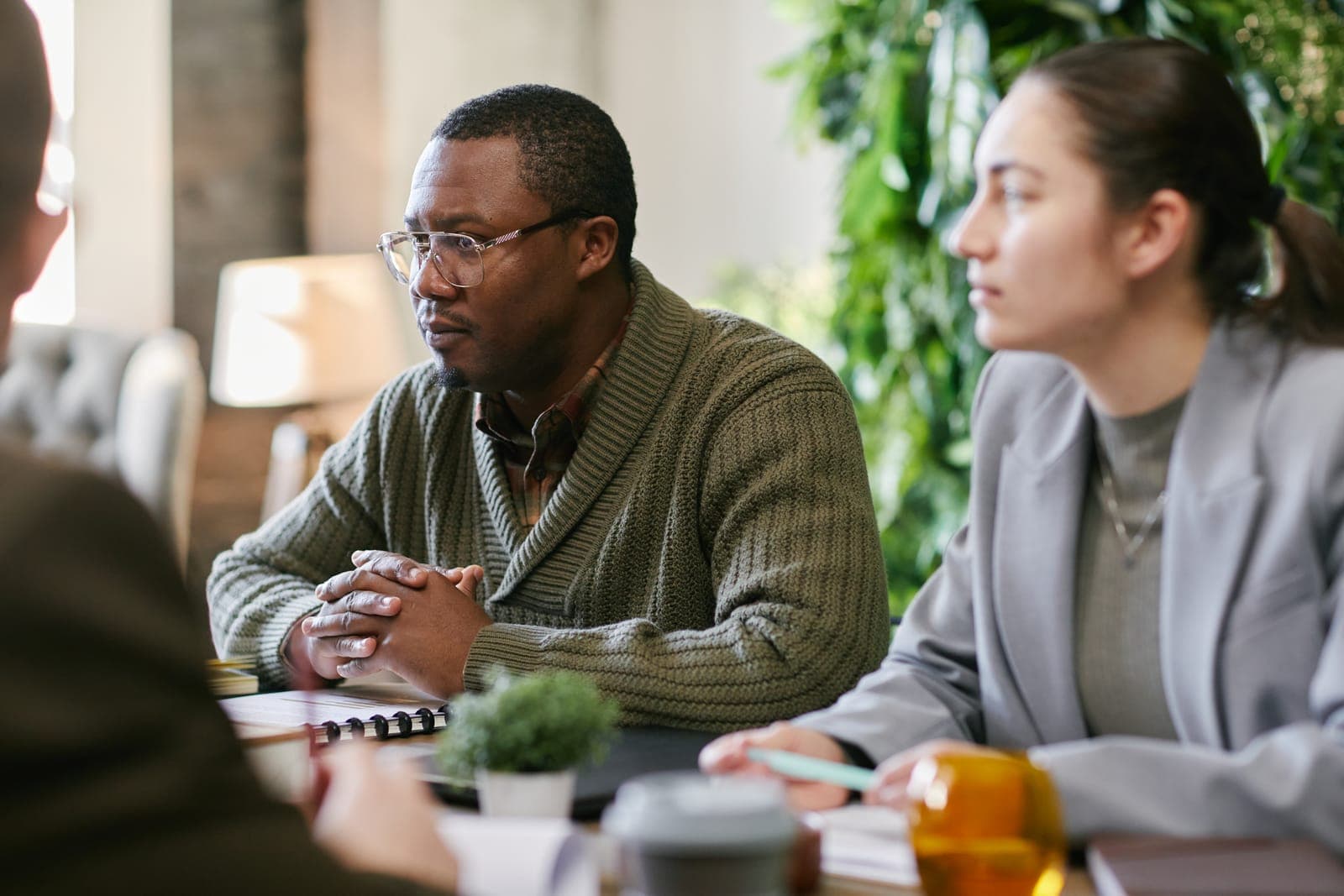 A diverse group of professionals in an animated discussion at the workplace