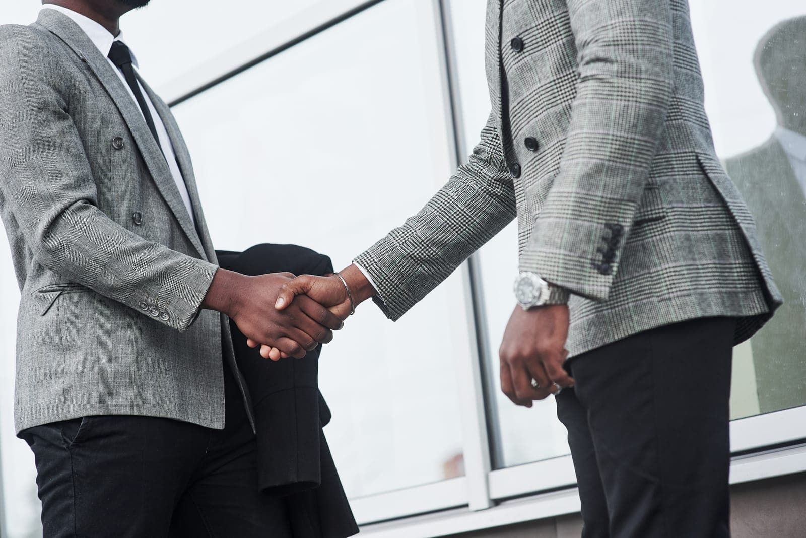A professional handshake between two business colleagues